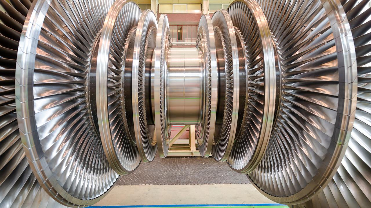 A steam turbine at an electric power plant delivers